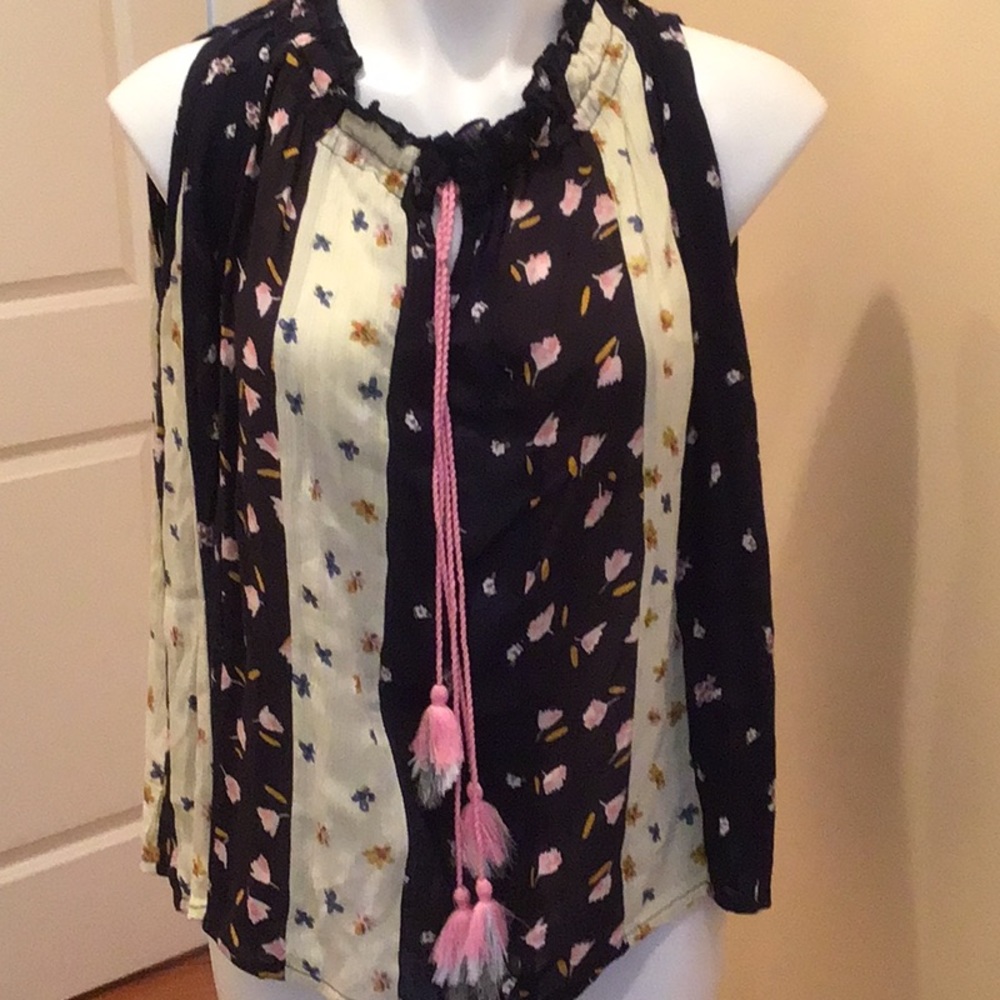Sleeveless paneled floral top with tassels